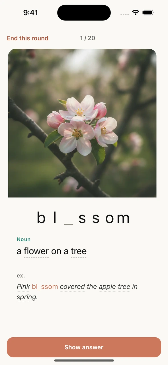 An actual first-encounter blossom card with a flower image and six visible hint letters.